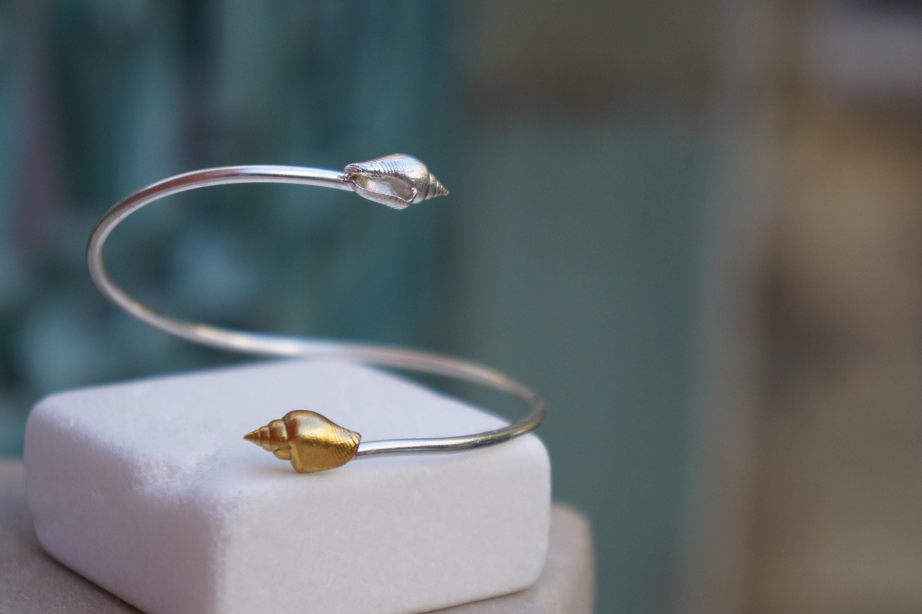 Silver Shell Bracelet: Adjustable Cuff with Gold Details