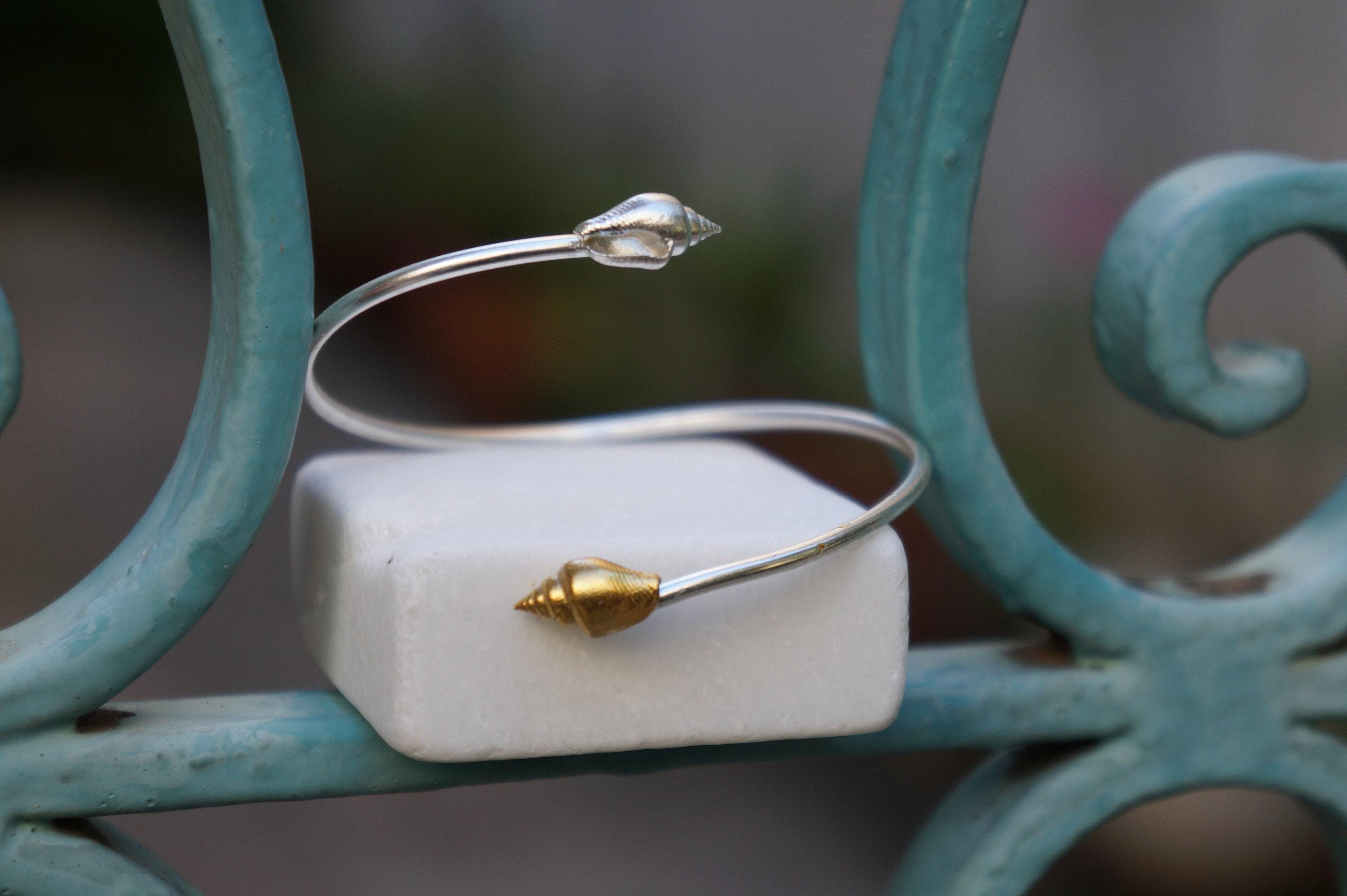 Silver Shell Bracelet: Adjustable Cuff with Gold Details