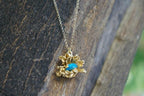 Pressed Daisy Pendant Necklace: Gold on Sterling Silver with Blue Murano