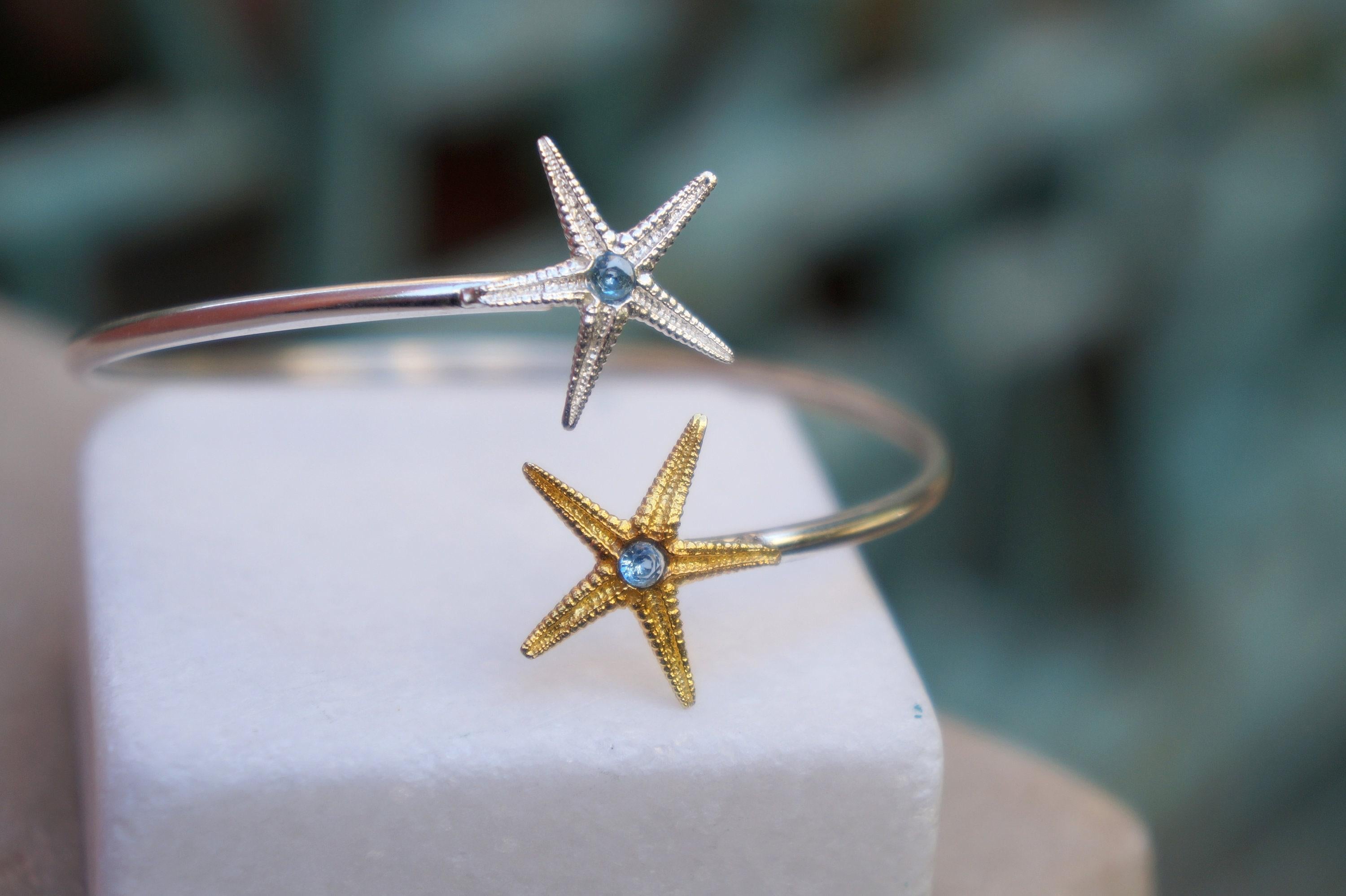 Silver Starfish Bracelet: Adjustable Cuff with Blue Zircon