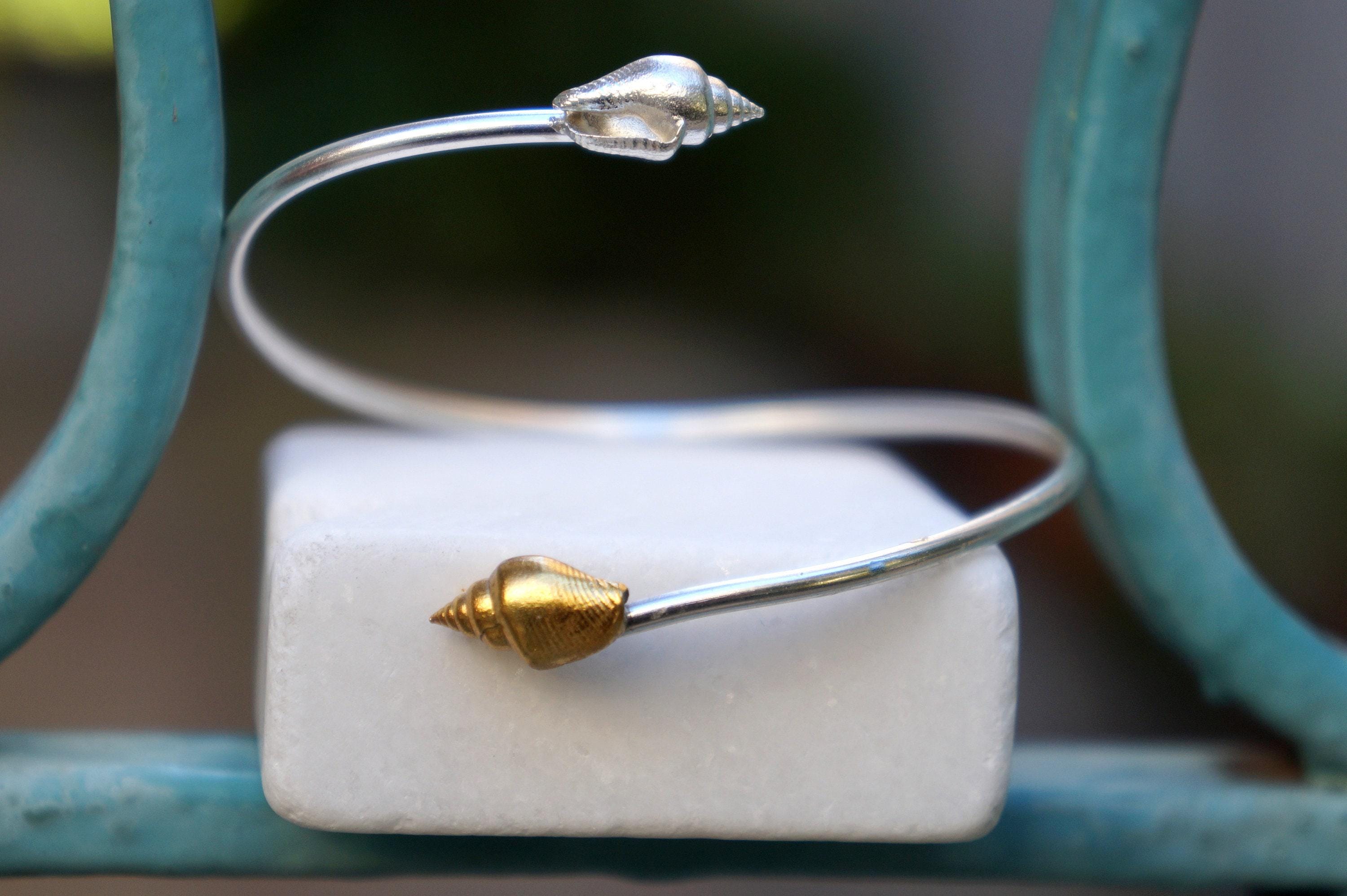 Silver Shell Bracelet: Adjustable Cuff with Gold Details