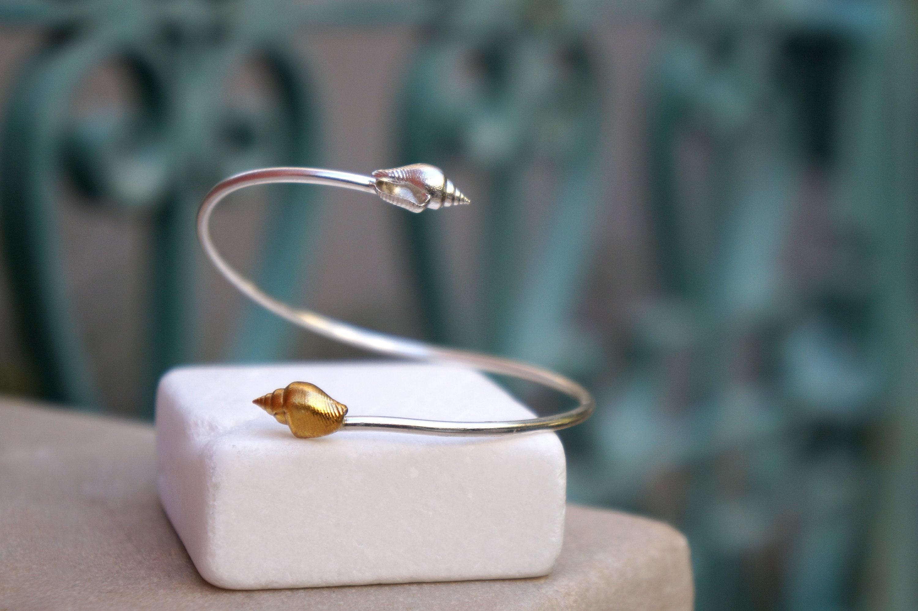 Silver Shell Bracelet: Adjustable Cuff with Gold Details