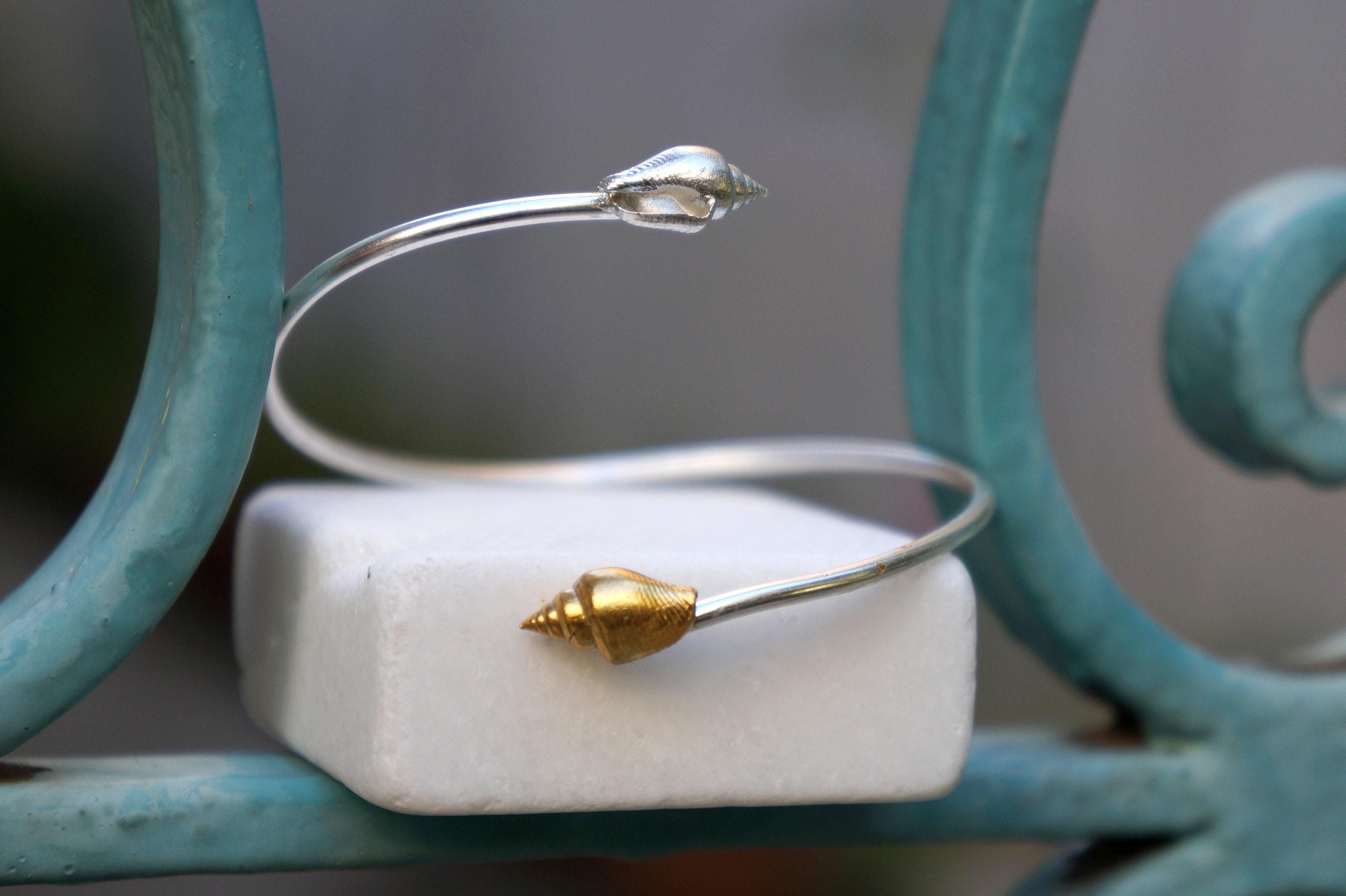 Silver Shell Bracelet: Adjustable Cuff with Gold Details
