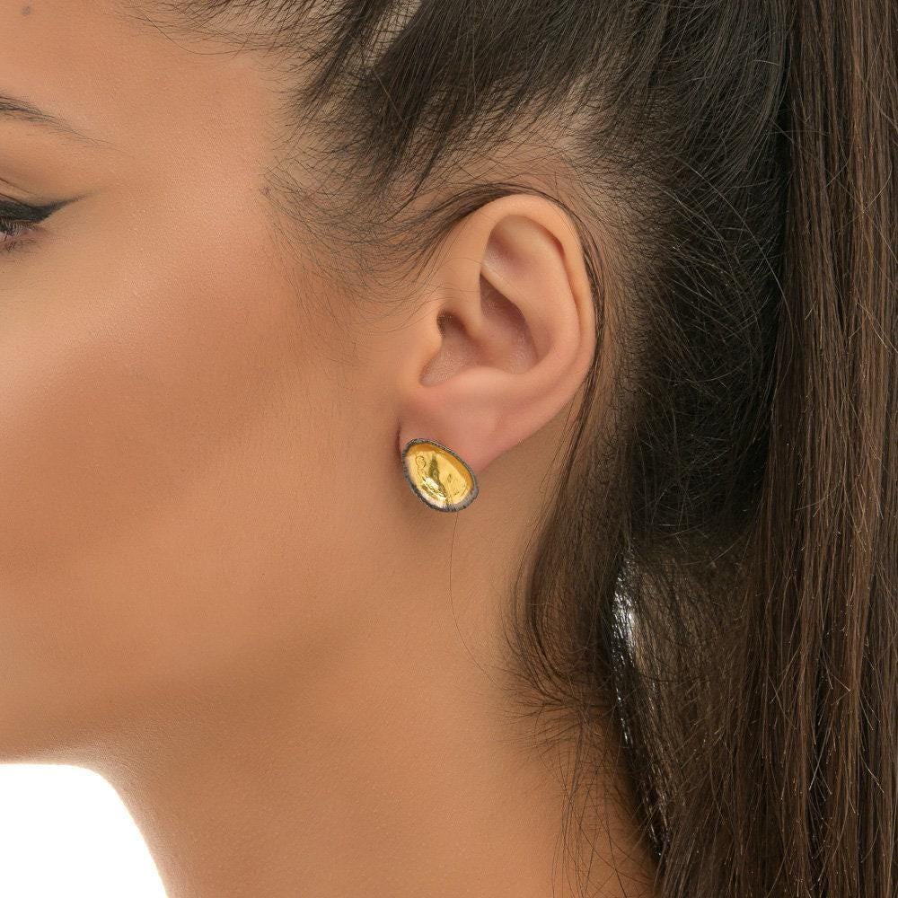 Two-Tone Limpet Stud Earrings - Lightweight design ideal for everyday wear or special occasions.Gold and Black on recycled Brass.