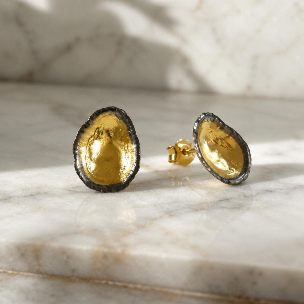 Two-Tone Limpet Stud Earrings - Lightweight design ideal for everyday wear or special occasions.Gold and Black on recycled Brass.