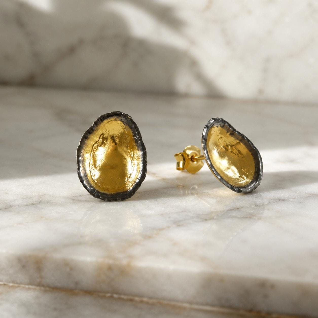 Two-Tone Limpet Stud Earrings - Lightweight design ideal for everyday wear or special occasions.Gold and Black on recycled Brass.